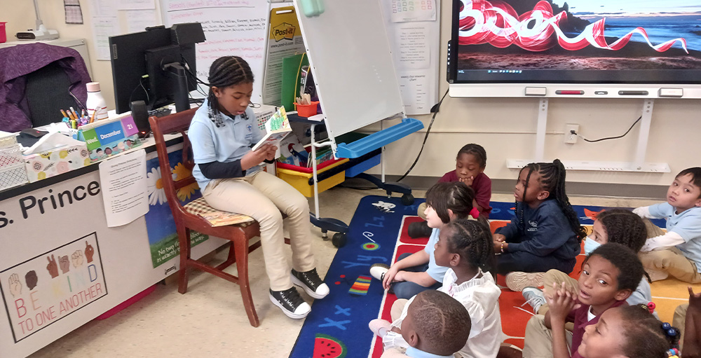 Citizenship & Science Academy of Rochester Promotes Reading to Kindergartener's by Having a 2nd Grader Read to Them